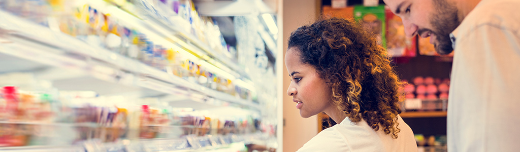 Image of a man and woman shopping for groceries