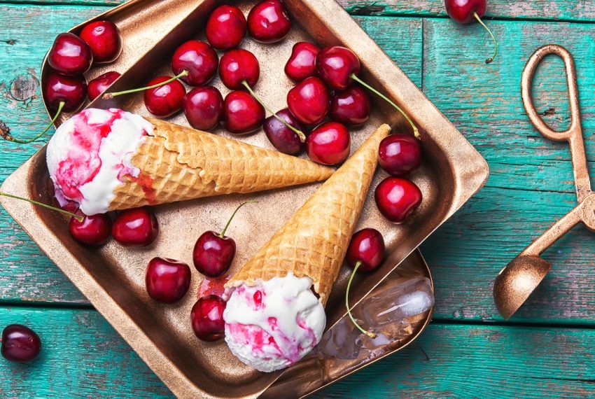 Ice Cream cones in a pan with black cherries