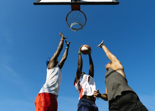 friends playing basketball in court. Friends Concept.