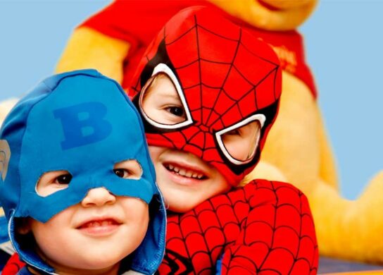 Kids in superhero costumes