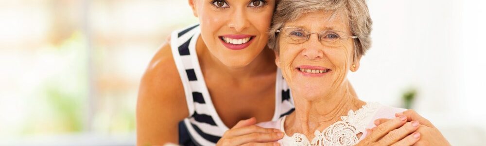 Young and older woman hugging