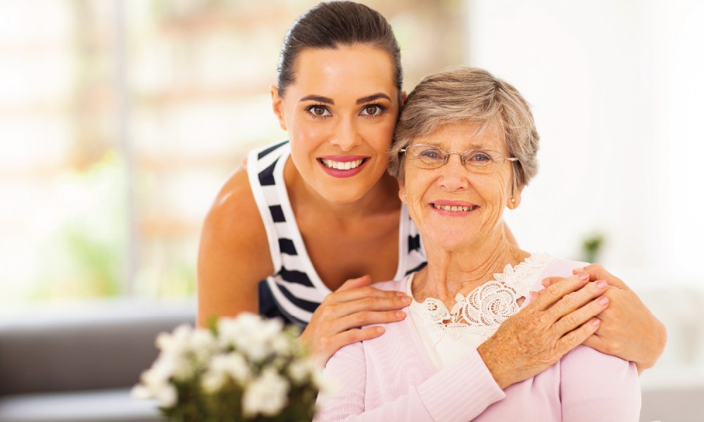 Young and older woman hugging