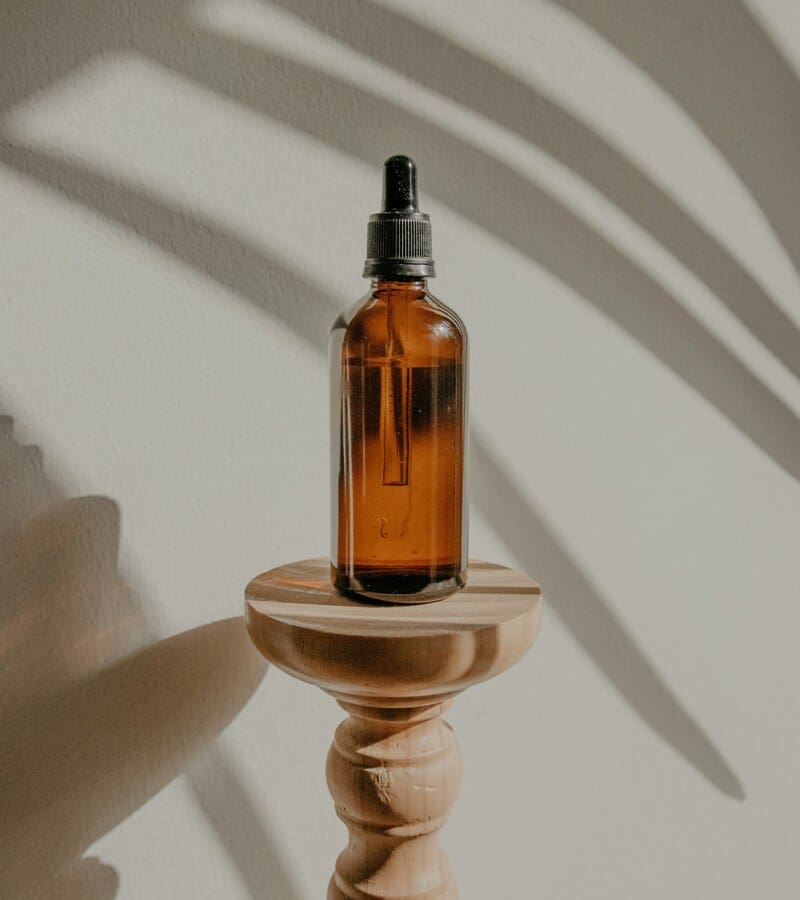 brown vial on pedestal