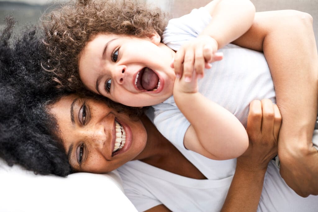 Mother Tickling Child